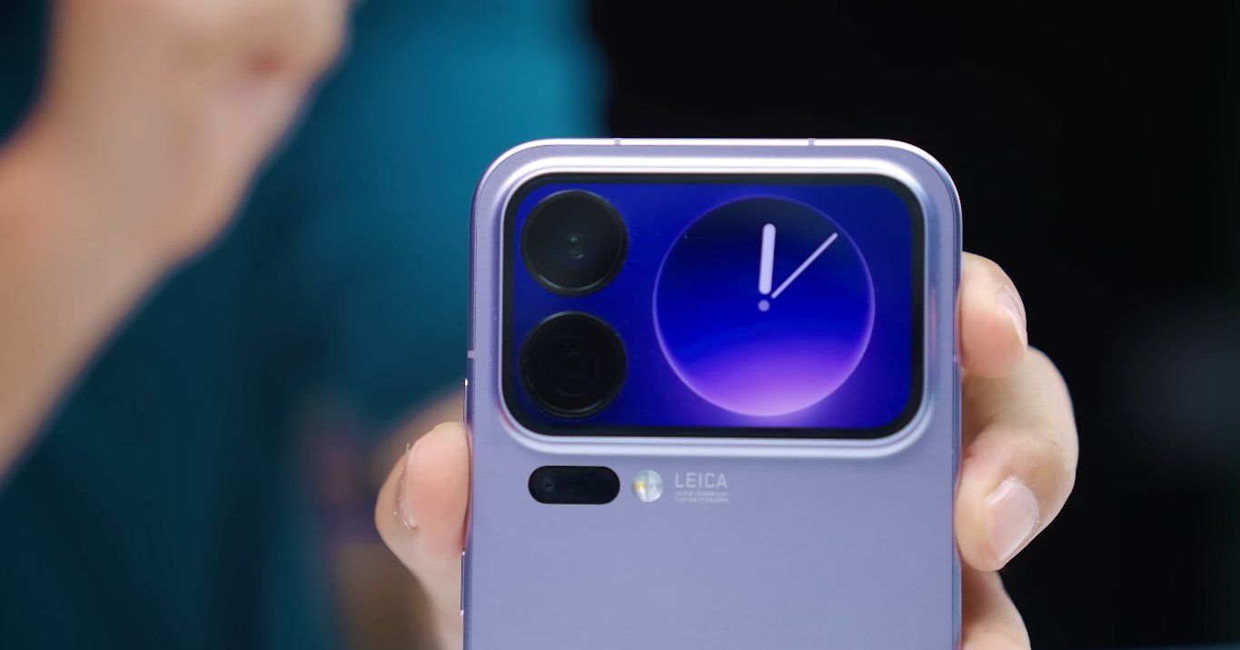 Hand holding smartphone with camera