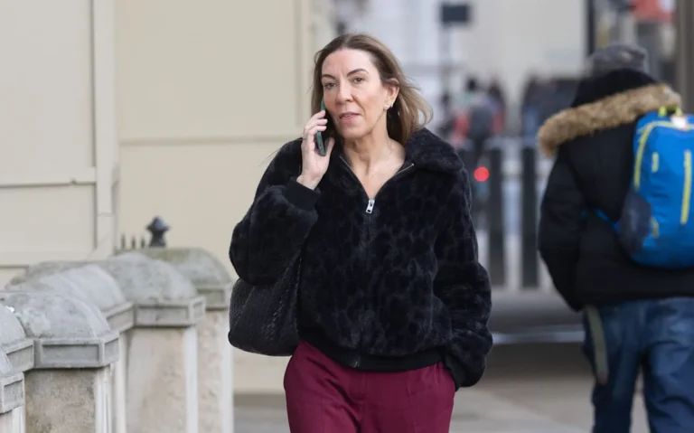 A photo of the Cabinet Office building in London, with a red flag symbolising the bullying report scandal, highlighting the need for transparency and accountability in government institutions, particularly in regards to workplace bullying and the behaviour of senior officials.