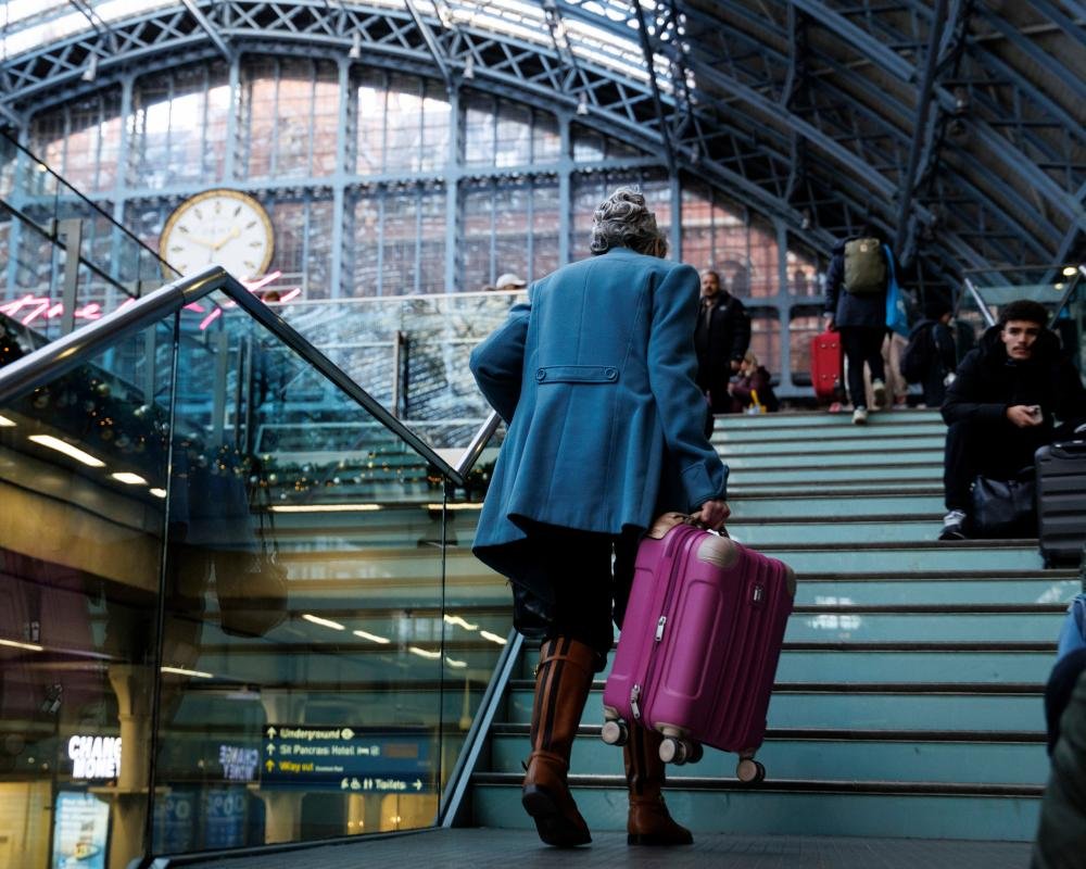 eurostar train at station with passengers waiting