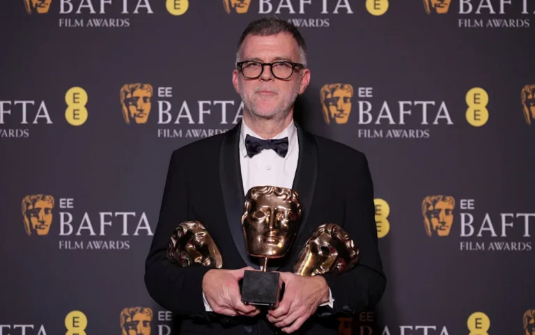 One Battle After Another's cast and crew celebrate their six BAFTA awards, a night to remember in the world of cinema, with the film's director and actors posing with their awards, beaming with pride and happiness, as the audience applauds in the background, a scene filled with colour and emotion