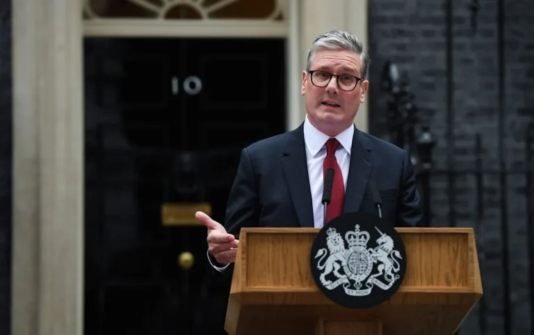Labour leader Starmer speaking at a conference, with a concerned expression, highlighting the uncertainty surrounding his vision for Britain, and the potential impact on the country's behaviour and economy