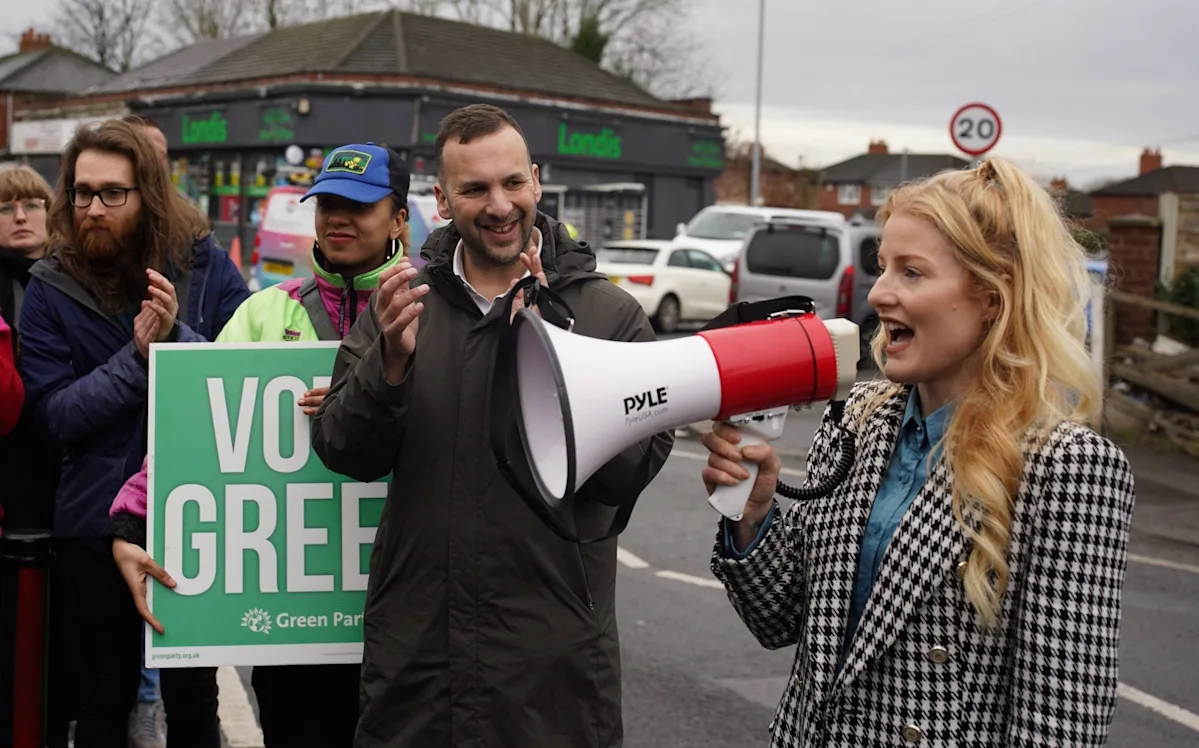 A descriptive image of the Greens' dirty tricks in Gorton and Denton, highlighting the importance of accountability in politics and the need for transparency and honesty in political dealings, with a focus on the Greens' behaviour and its impact on the local community