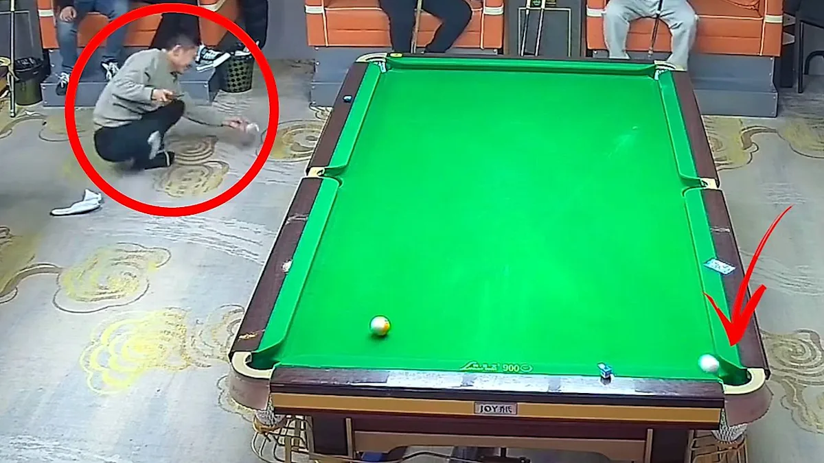 A man in China falls after slipping during a billiards shot, highlighting the importance of safety and awareness in recreational activities with a focus on billiards safety and accidents