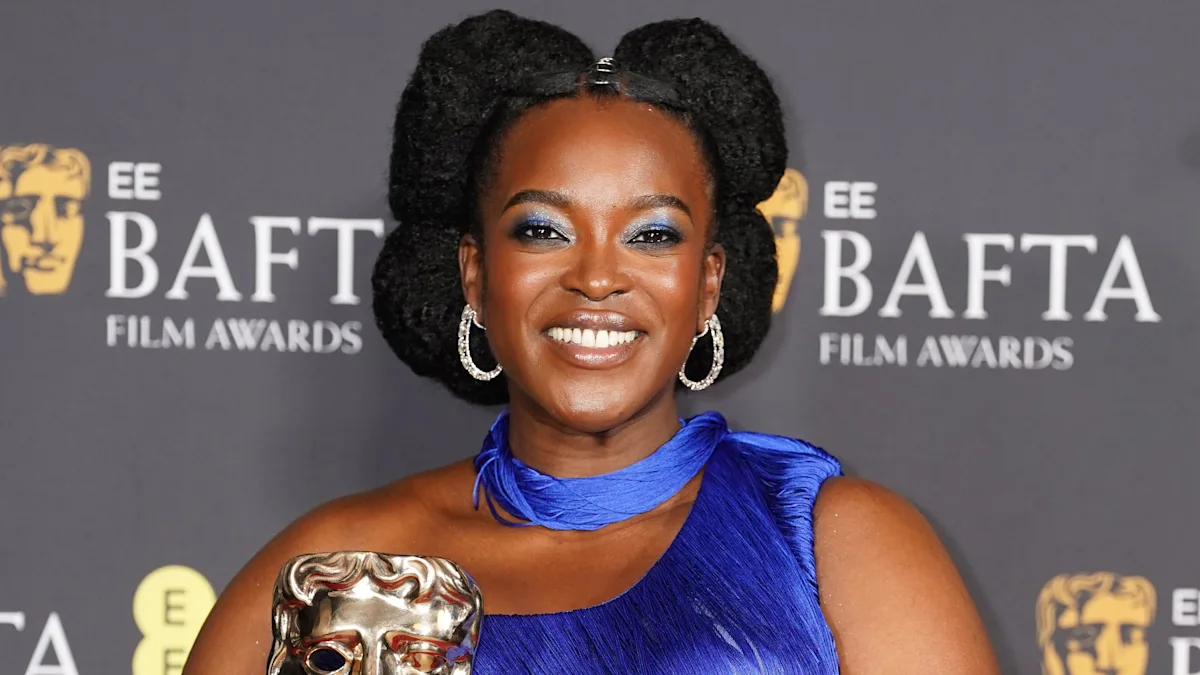 Wunmi Mosaku at the Baftas, looking stunning in a red dress, but her behaviour has been called into question, sparking a wider conversation about celebrity behaviour and its impact on fans, with the primary keyword being Wunmi Mosaku