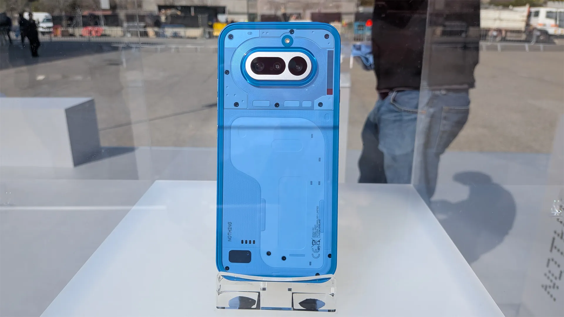 The Nothing Phone 4a in its four colour options, including black, blue, pink, and white, showcasing its stunning transparent design and camera system, a masterclass in mid-range smartphone design