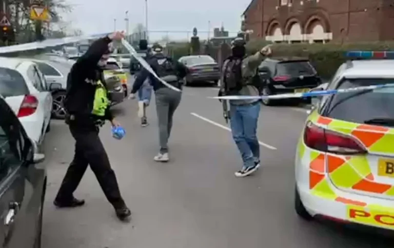 A photo of a police cordon near a primary school, with officers investigating a stabbing incident, highlighting the importance of counter-terror efforts and community safety, with a focus on the primary keyword phrase counter-terror police