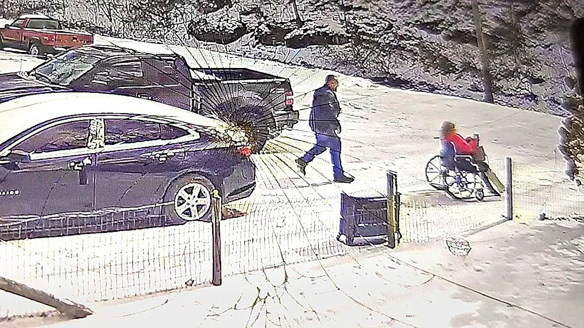 A Kentucky couple laughing and smiling as they experience a hilarious wheelchair mishap, showcasing their ability to find humour in difficult situations with a positive attitude and colourful personalities