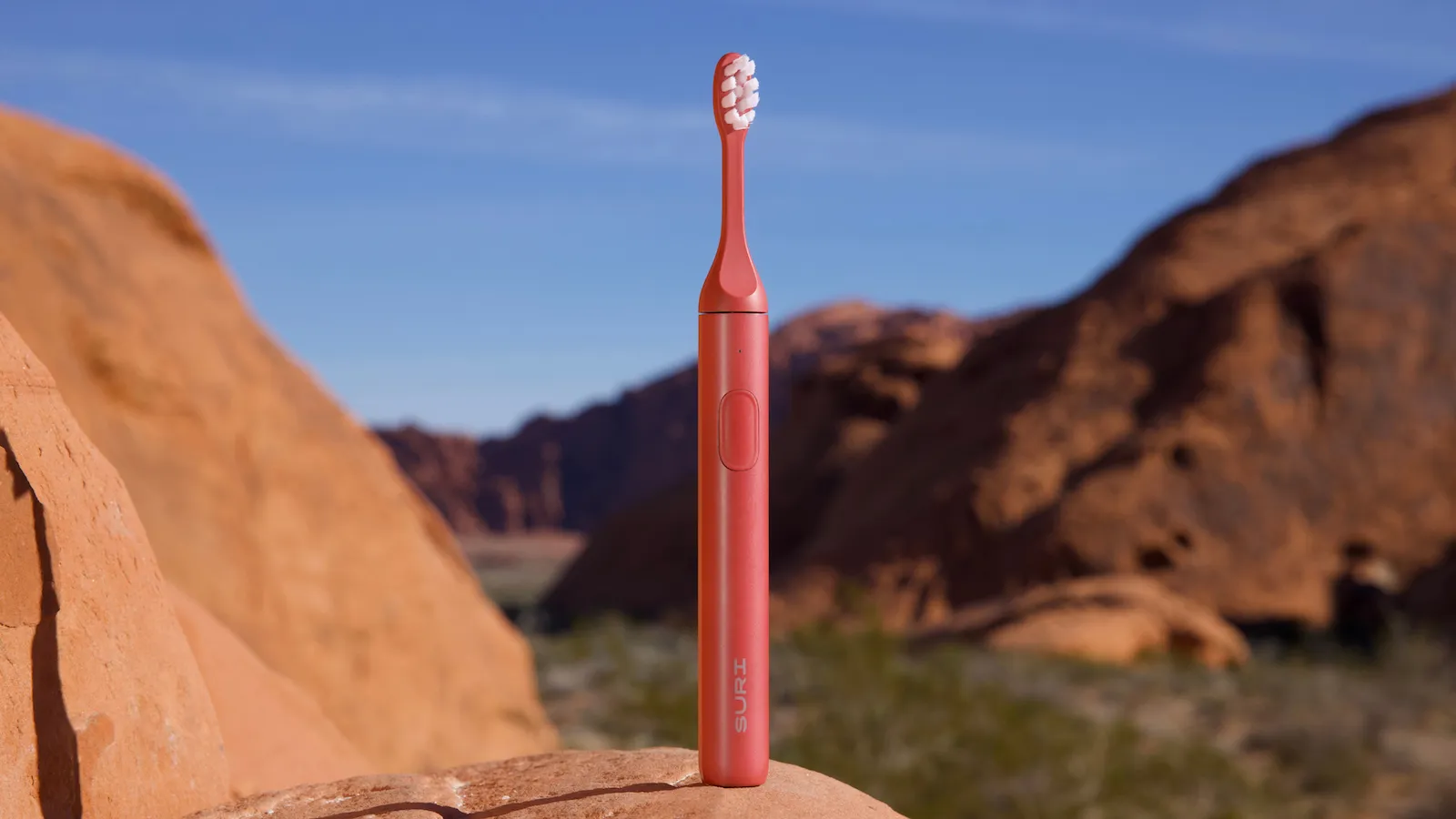 The Suri 2.0 electric toothbrush in its new Canyon Sunrise colour, with a recyclable aluminium handle and plant-based brush heads, perfect for a sustainable oral care routine in the UK