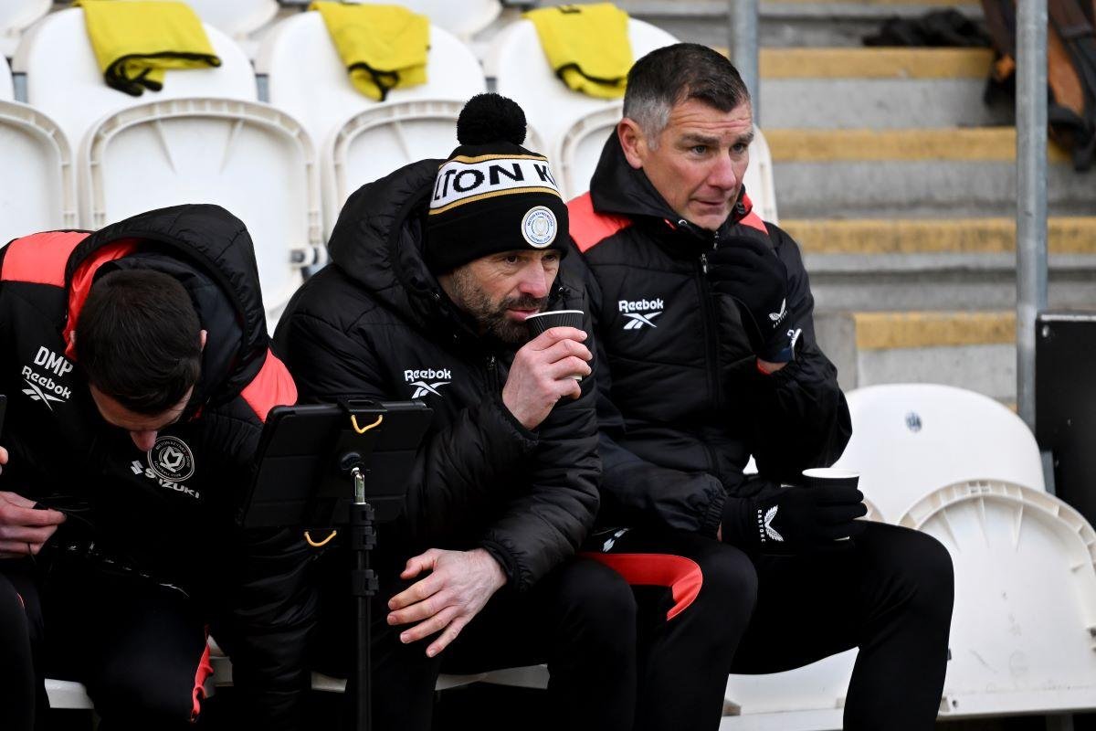 MK Dons boss Paul Warne reacts to penalty