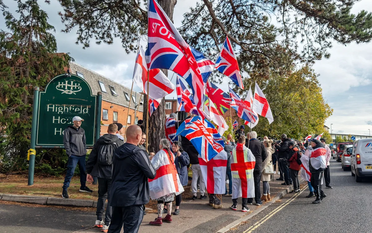 A woman walking alone near an asylum hotel, highlighting the need for improved public safety measures and community engagement to ensure women's safety and prevent similar attacks