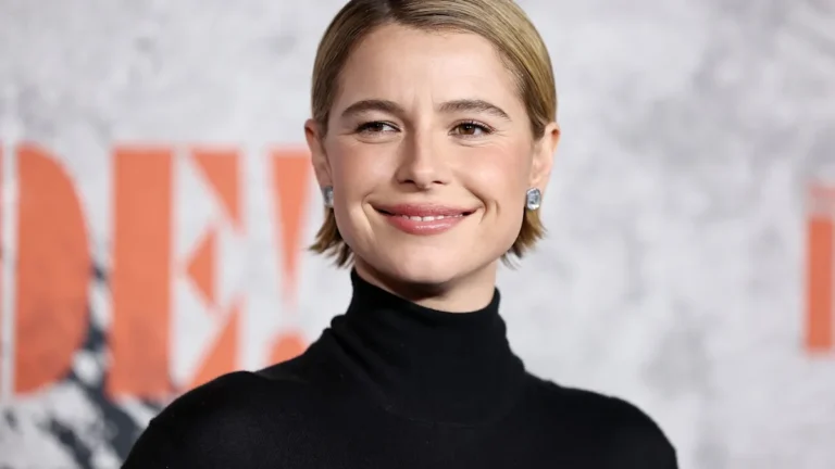 Jessie Buckley smiling and looking relieved after her health scare, with a mix of colour and light in the background, symbolising hope and recovery from her onstage incident