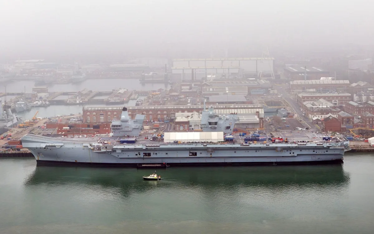 Aircraft carrier at sea with a French naval vessel in the background, symbolising the potential partnership between the UK and France in maritime security. The image captures the complexity of modern naval defence and the need for international cooperation in addressing emerging threats. With the UK's aircraft carrier at the forefront, the scene is set for a new era of collaborative defence strategies.