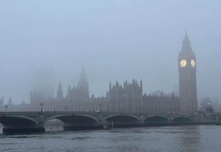 A snowy landscape in the UK, with a frosty windscreen and snowflakes gently falling, as forecast by the Met Office, with a primary keyword of UK weather