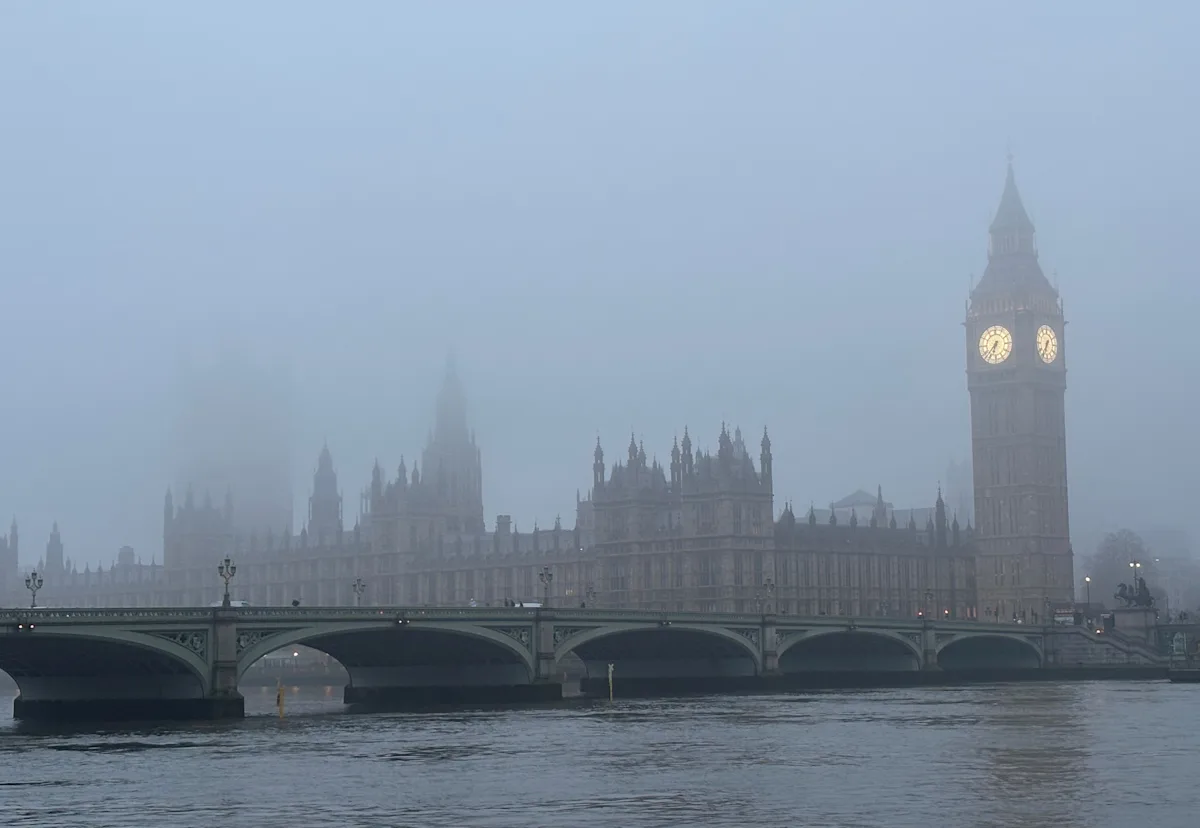 A snowy landscape in the UK, with a frosty windscreen and snowflakes gently falling, as forecast by the Met Office, with a primary keyword of UK weather