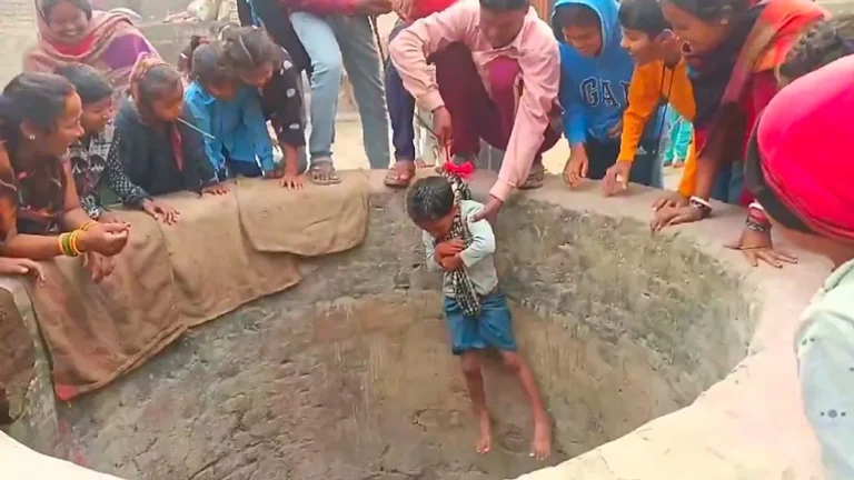 A young child in India being lowered into a well to rescue a stranded baby goat, demonstrating remarkable bravery and selfless behaviour, with a focus on animal welfare and compassion, the child's actions have inspired many and sparked a wider conversation about the importance of protecting vulnerable creatures