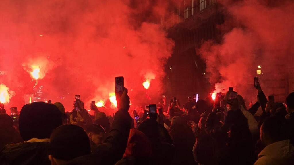 African football fans in Paris cheering