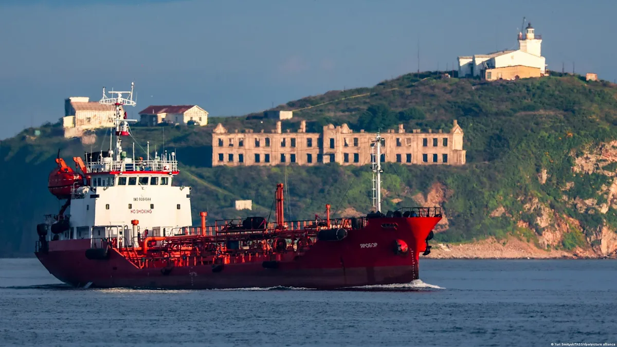 A tanker ship carrying Russian oil stranded at sea, with a US flag in the background, symbolising the temporary permit to sell the oil and alleviate the global energy crisis, as the world struggles to cope with the colour of changing energy dynamics