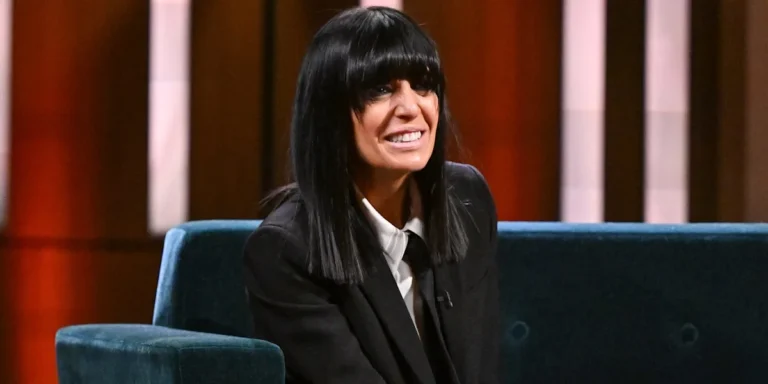 Claudia Winkleman smiles as she hosts her new show, surrounded by a colourful studio audience, the Claudia Winkleman Show is a new UK television programme that features entertainment and conversation, with a focus on celebrity interviews and games