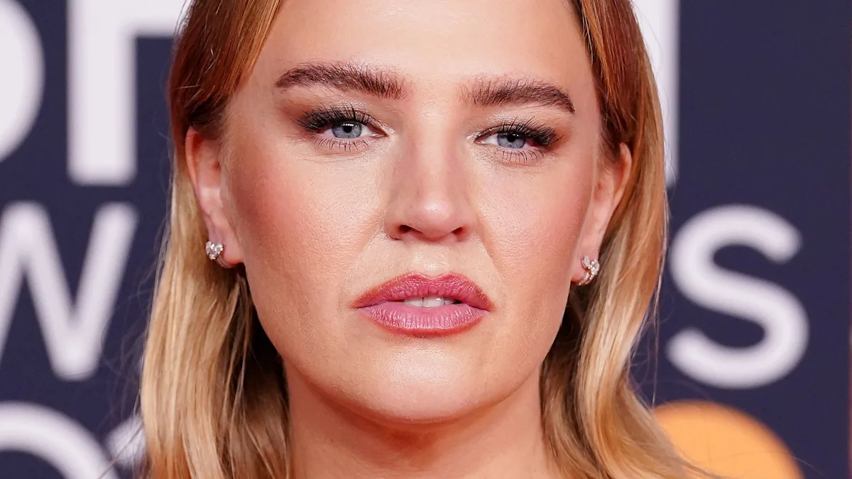 Self Esteem performing on stage, highlighting the importance of diversity and representation in the music industry, with a focus on bridging the privilege gap