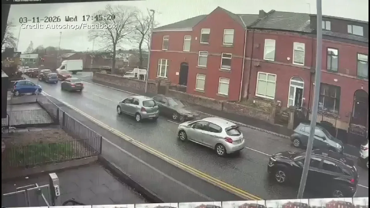A damaged police van and parked cars after a collision on a road, with debris scattered all over the road, highlighting the importance of road safety and responsible driver behaviour, particularly in emergency situations.