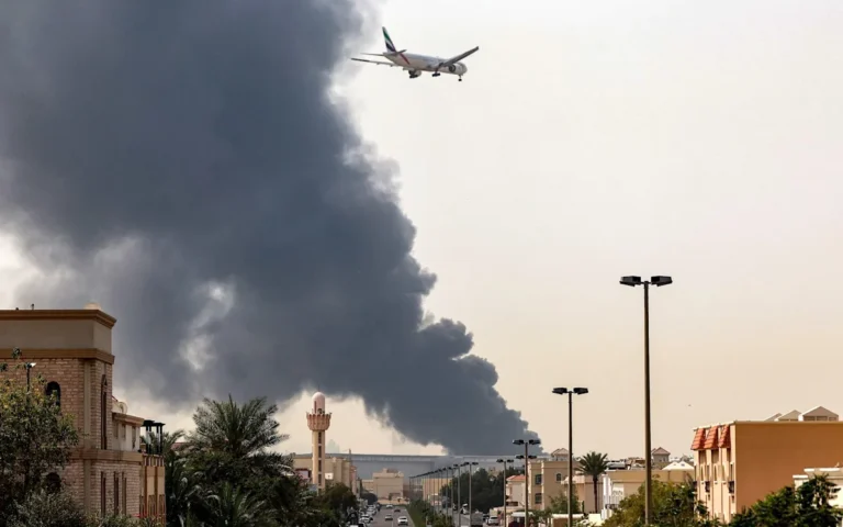 Aerial view of Dubai hotel hit by Iranian drone, with people gathering outside to observe the damage, as authorities take action against those who shared photos of the incident, analysing the situation and taking measures to maintain national security