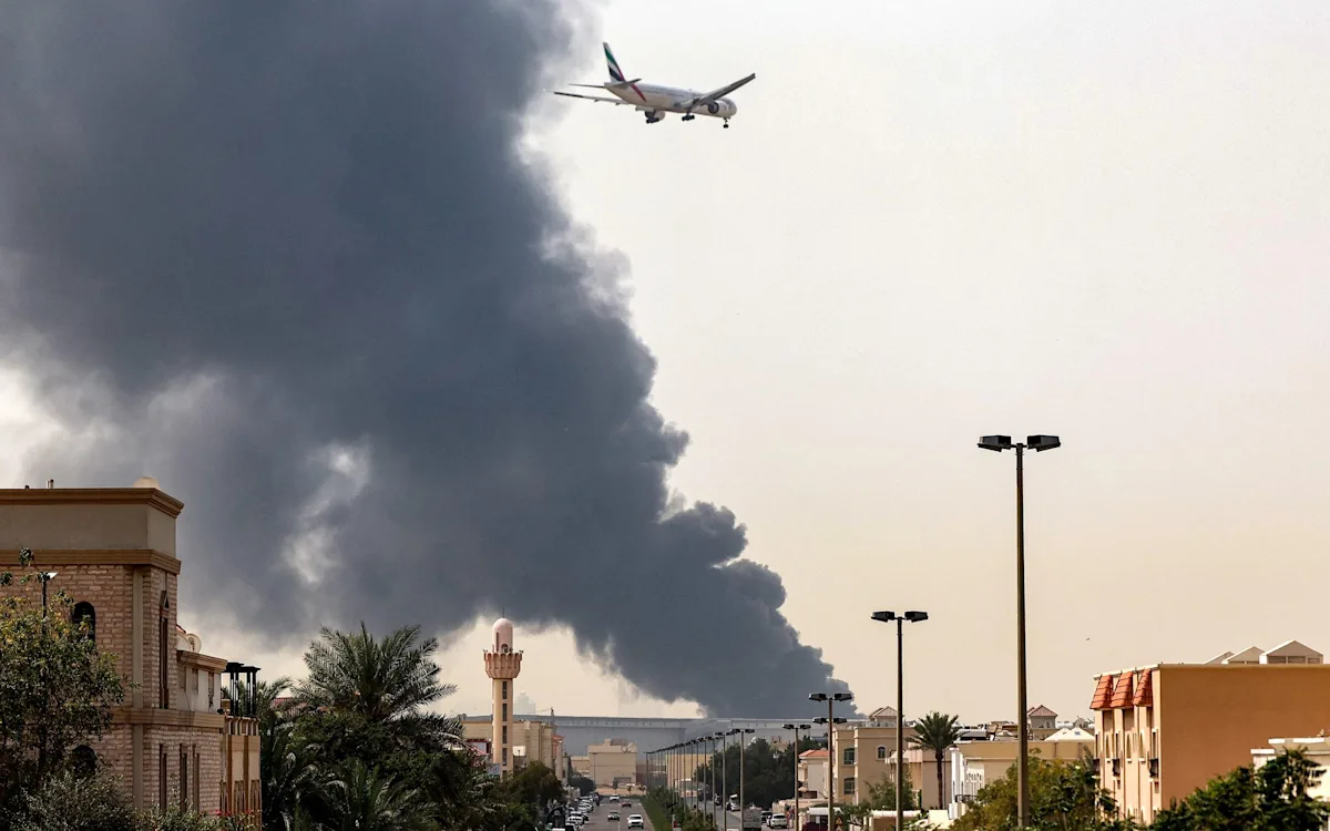 Aerial view of Dubai hotel hit by Iranian drone, with people gathering outside to observe the damage, as authorities take action against those who shared photos of the incident, analysing the situation and taking measures to maintain national security