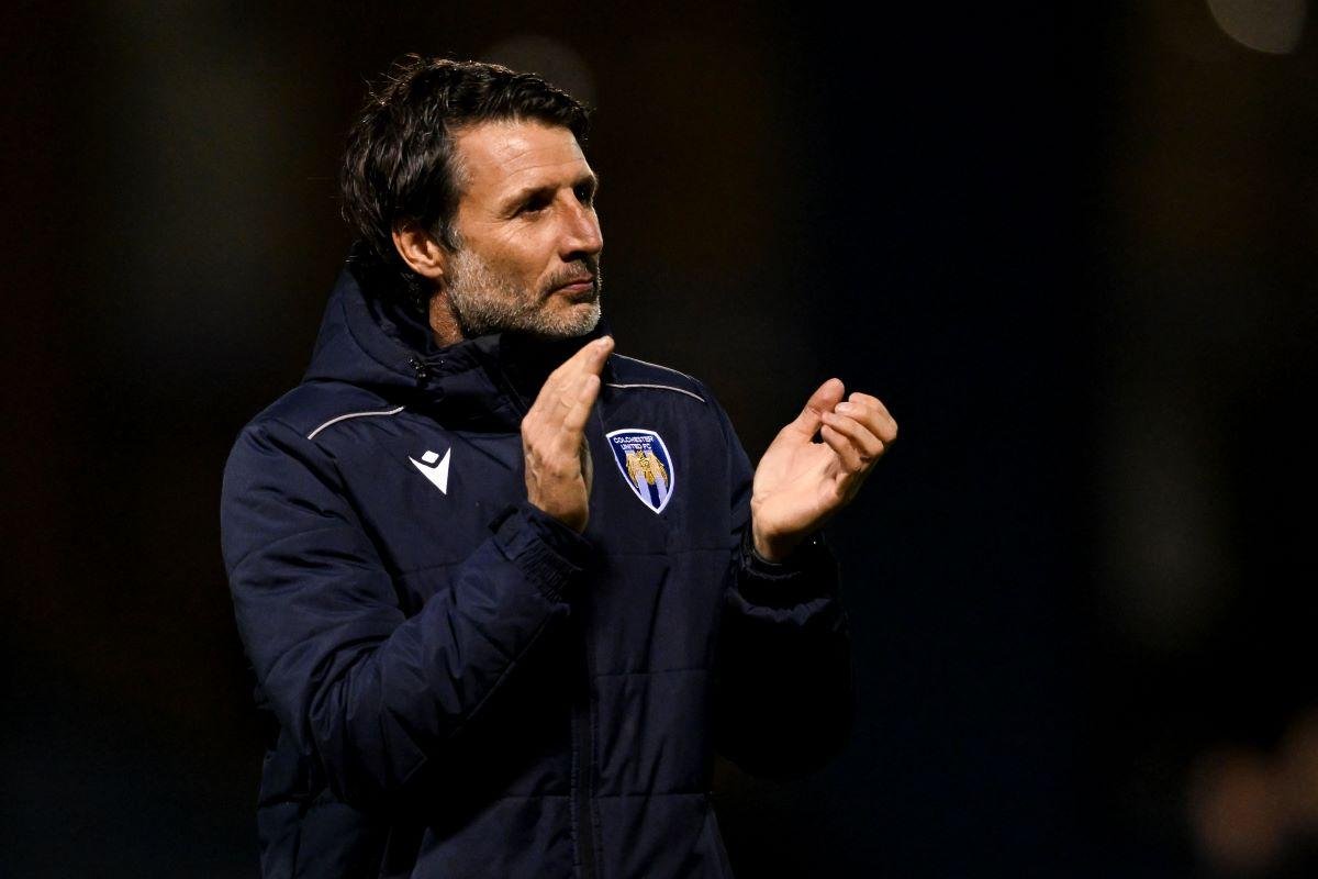 Colchester United players celebrating festive win