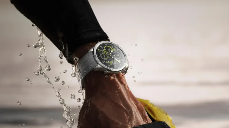 A person swimming in the sea with a smartwatch on their wrist, with a warning symbol overlayed on the image, highlighting the risks of water damage in the UK