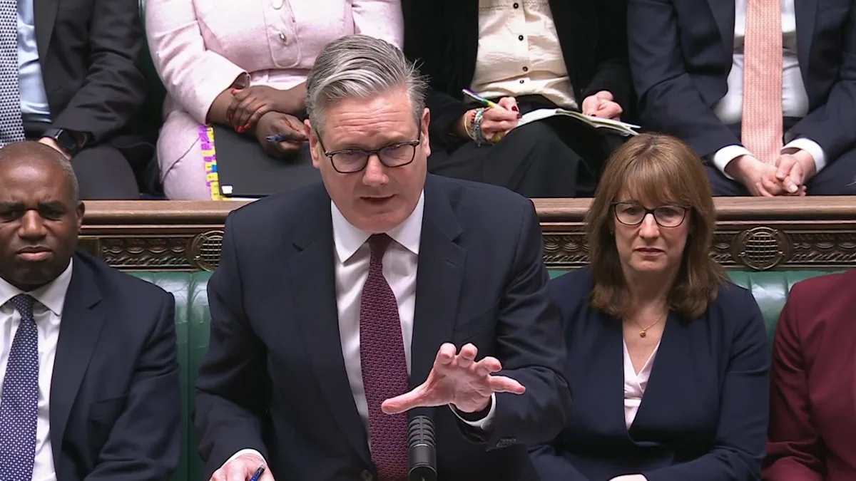 Keir Starmer speaking in parliament, with a caption discussing the cost of living crisis and benefit recipients, highlighting the need for effective economic policy to support all members of society