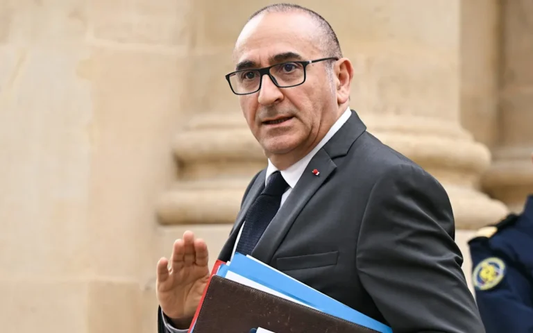 French police officers on patrol in a city, with a description of the new shock tactics to combat crime in the background, including the use of technology and rehabilitation programmes to support offenders