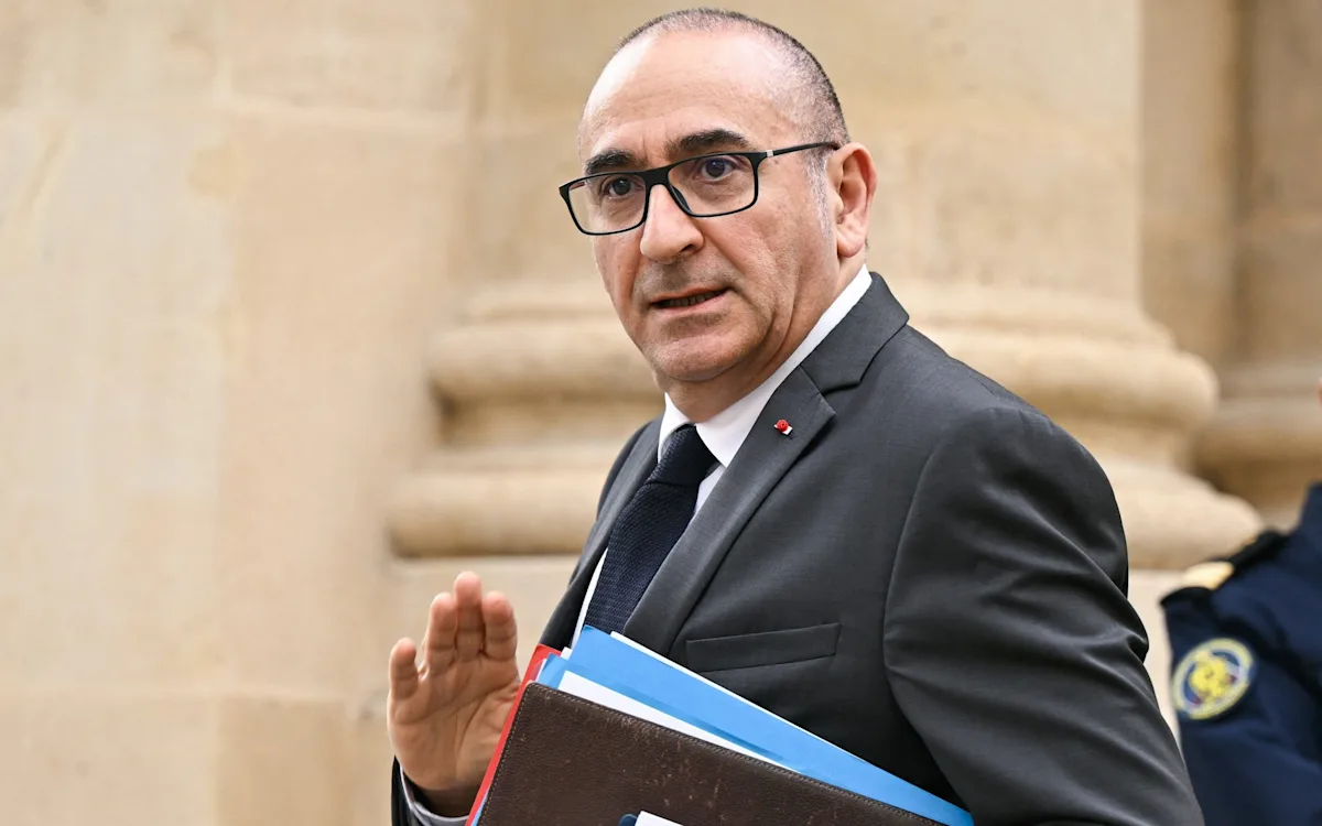 French police officers on patrol in a city, with a description of the new shock tactics to combat crime in the background, including the use of technology and rehabilitation programmes to support offenders
