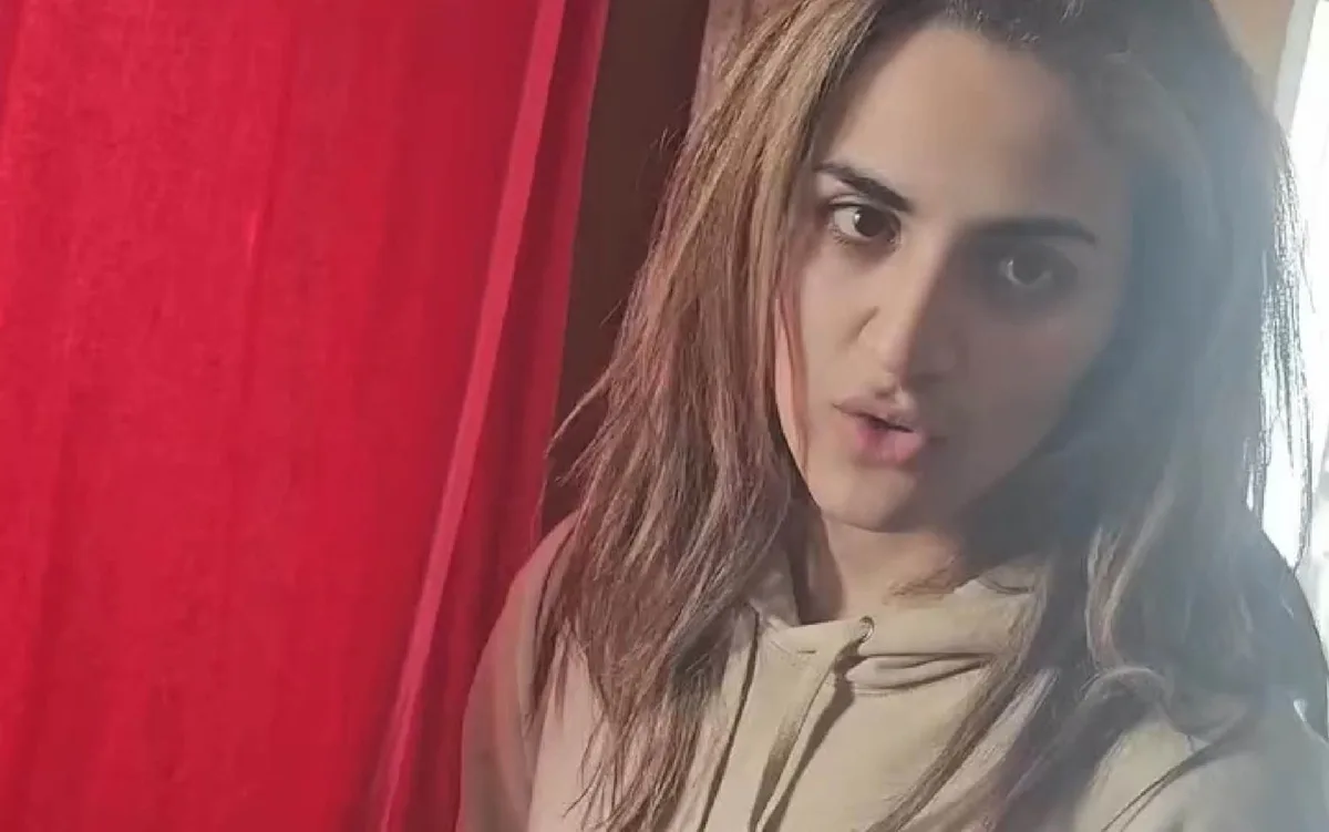 A photo of a doctor in a hospital setting, with a red flag indicating a potential security threat, highlighting the primary keyword 'NHS doctor charged with Hamas support'