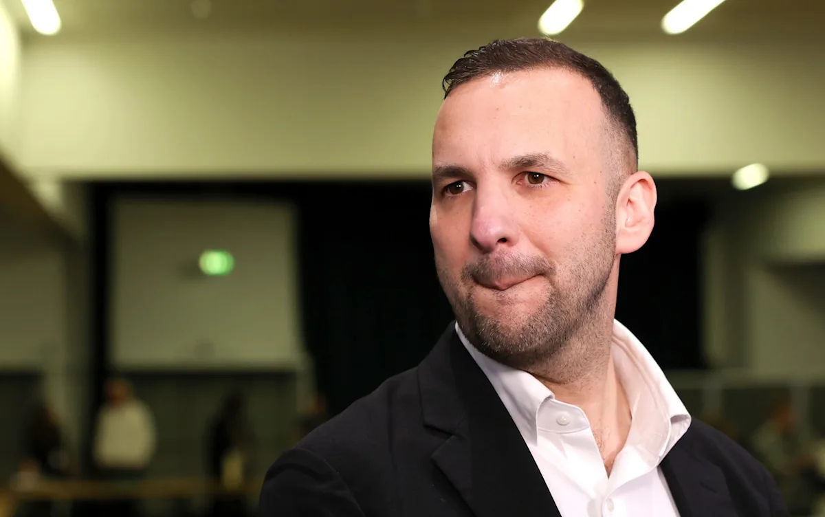 A group of people from different backgrounds and ages standing together, holding signs that read 'equality' and 'justice', with a green forest in the background, symbolizing the primary keyword phrase 'environmental activism'