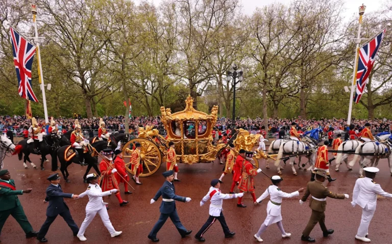 The BBC logo on a screen with a cityscape in the background, symbolising the corporation's presence in the British media landscape, with a focus on its flagship service and streaming services
