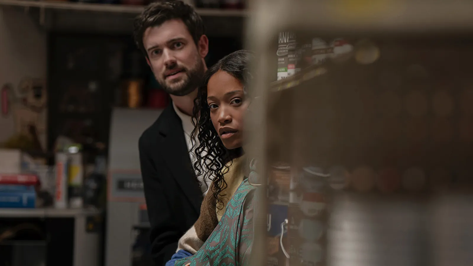 Unmissable UK Thrillers on Sky TV: What to Watch Now 1 A screenshot from The 'Burbs, a new Sky series, showing a suburban street with a creepy house in the background, highlighting the primary keyword 'UK Thrillers' in a natural and descriptive way.