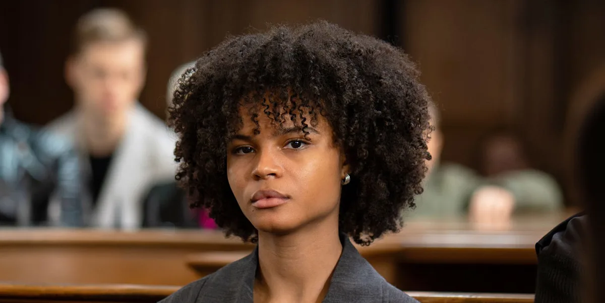 A dramatic scene from EastEnders featuring Jasmine Fisher, with a dark and ominous tone, highlighting the show's ability to tackle tough topics and complex behaviour, with a primary keyword of EastEnders