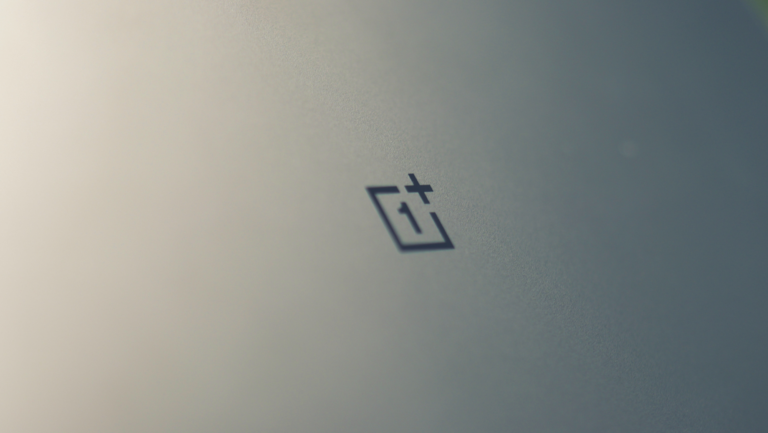 OnePlus gaming handheld console with a thick body, exaggerated hand grips, and physical shoulder buttons, featuring a pair of cameras on the back, set to take on the UK gaming market with its new Dimensity processor-powered device