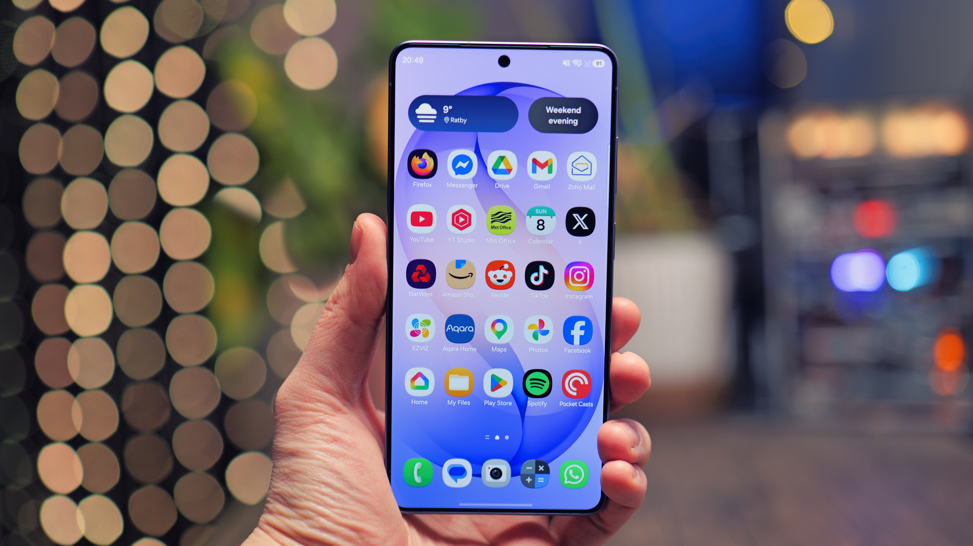 A close-up of a Google Pixel smartphone screen displaying the Android operating system, with a blurred background of a cityscape in the UK, highlighting the phone's speed and efficiency