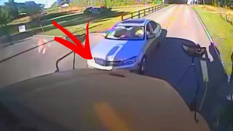 A school bus damaged after being hit by a car, with a focus on the importance of road safety and responsible driver behaviour, particularly when children are present, and the need to analyse situations and take necessary precautions to avoid accidents