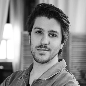 Gunzilla Games logo with a background image of the UK gaming industry, highlighting the studio's involvement in the NFT and gaming community, with a focus on the allegations of non-payment to workers and the impact on the UK gaming industry