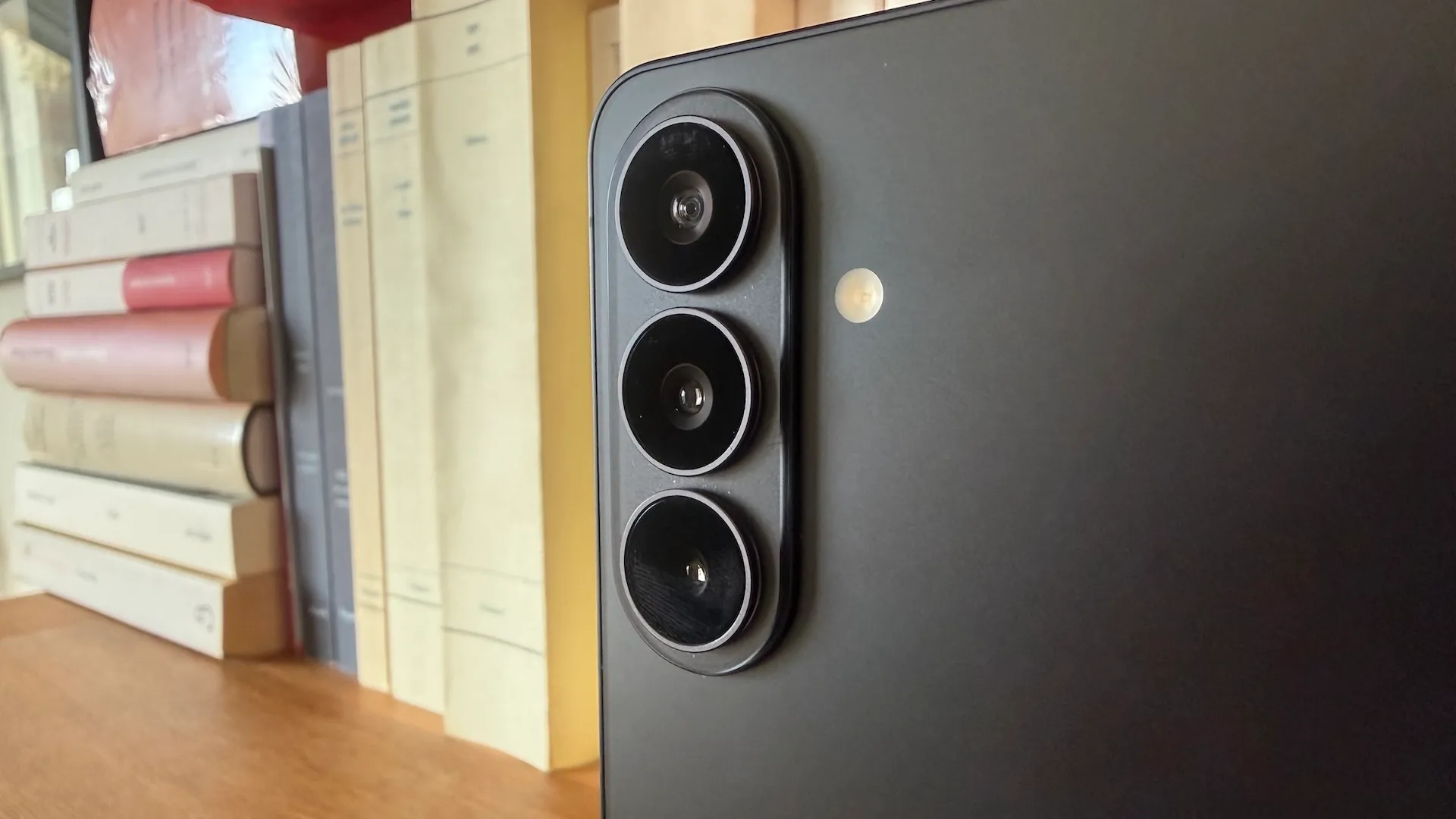 A Samsung Galaxy phone with a screen displaying the latest update, with a UK flag in the background, highlighting the importance of installing the update for UK users to protect their device from security vulnerabilities