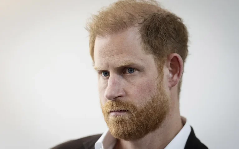Prince Harry at a charity event, with a descriptive alt text that includes the primary keyword 'defamation lawsuit', the royal family's charitable work and philanthropic efforts, and the potential consequences of the lawsuit on their reputation