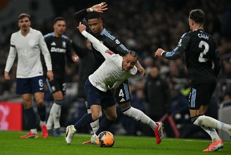 Tottenham players in action during FA Cup match