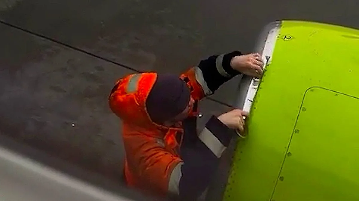 A plane engine covered in tape, sparking concerns about aviation safety and the use of makeshift repairs in aircraft maintenance, highlighting the importance of safety protocols
