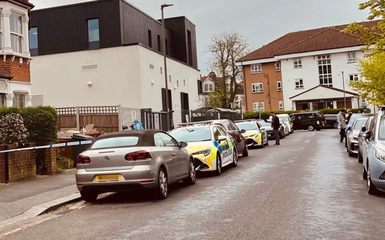 A London synagogue with a police car outside, following an attempted firebomb attack, highlighting the need for increased community security and antisemitism awareness