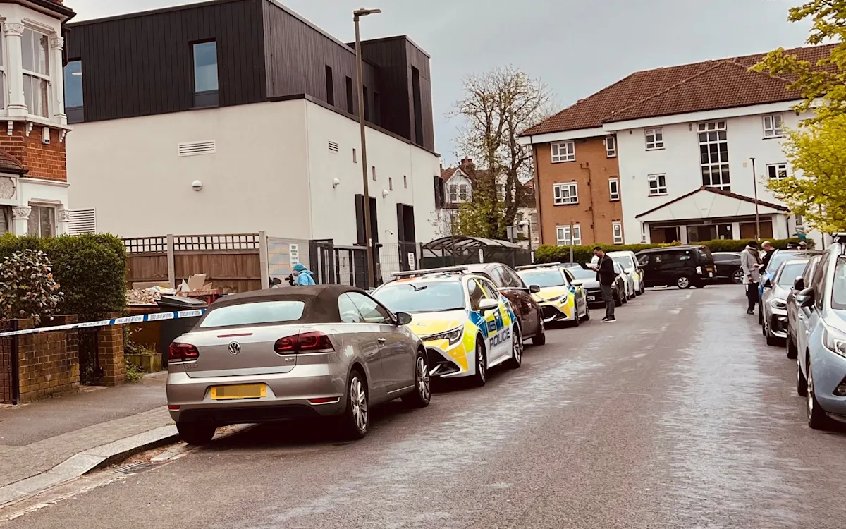 A London synagogue with a police car outside, following an attempted firebomb attack, highlighting the need for increased community security and antisemitism awareness