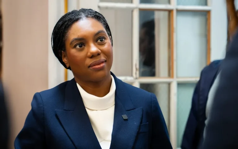 A photo of a sign indicating a single-sex toilet facility, with a mix of men and women in the background, highlighting the importance of respecting individual rights and dignity in public spaces