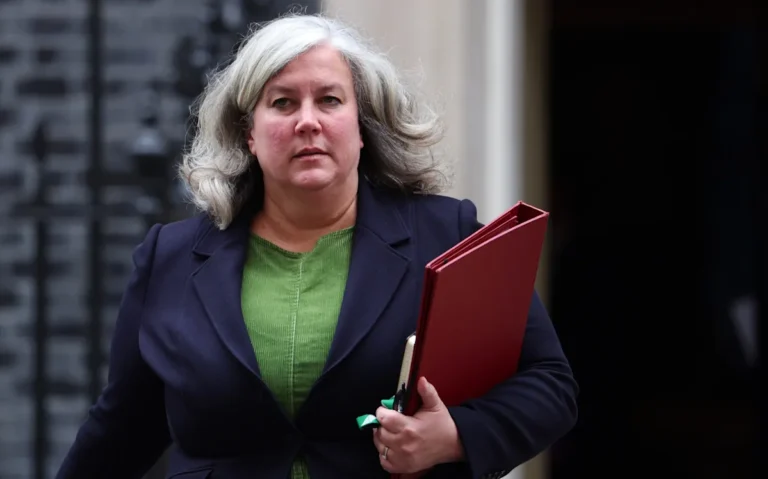 A car with a flat tyre due to a pothole, with a background of a busy UK road, highlighting the problem of potholes on UK roads and the need for better road maintenance, with the primary keyword being potholes