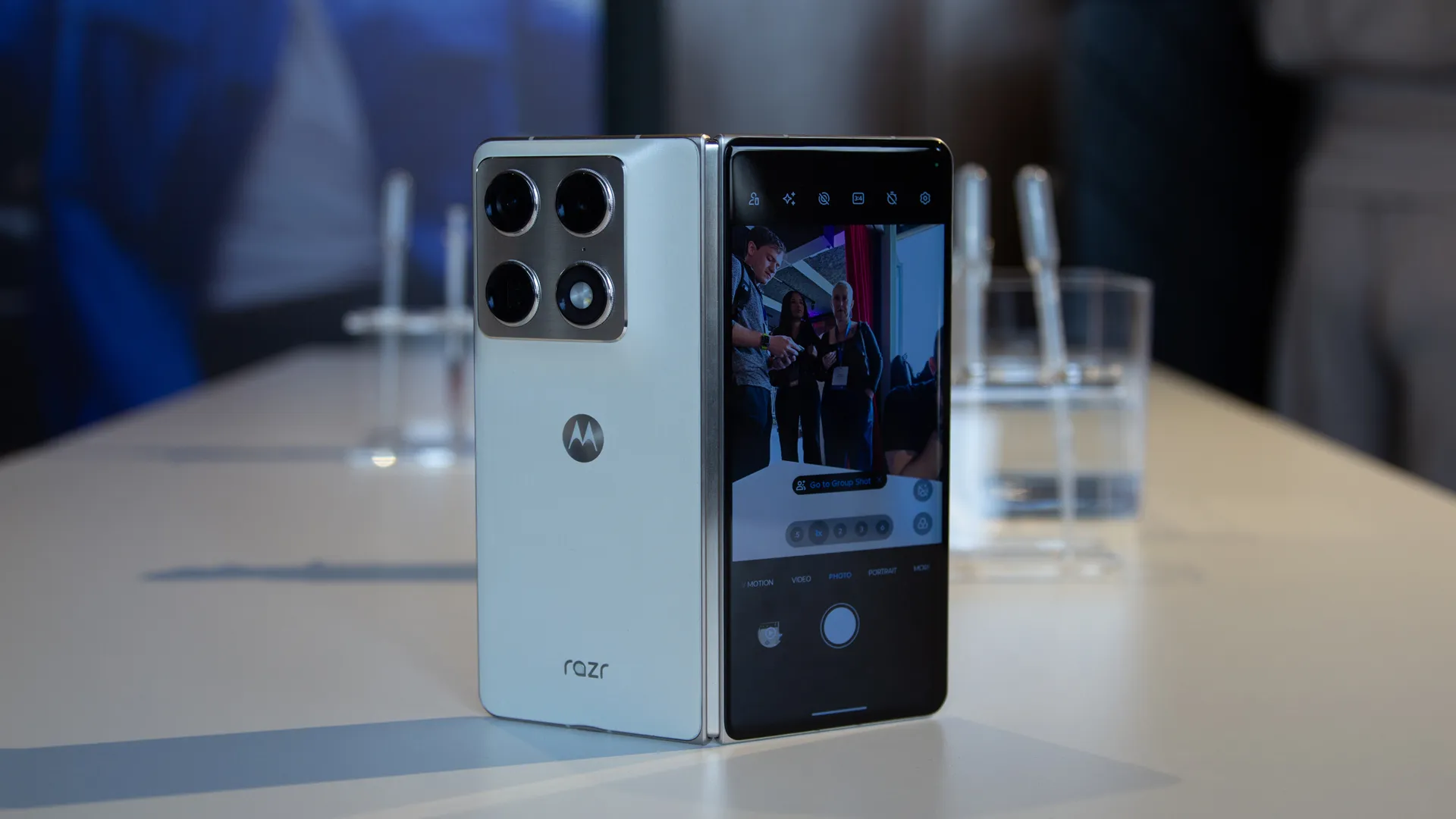 The Motorola Razr Fold is a book-style foldable phone with a unique design and impressive specs, featuring a large 6.7-inch OLED display, triple 50Mp camera set-up, and Snapdragon 8 Gen 5 processor, available to pre-order in the UK with a range of deals and discounts