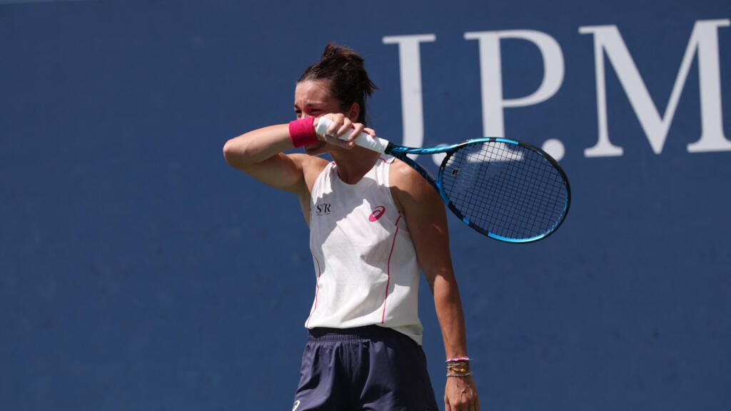 Lois Boisson in action at tennis tournament